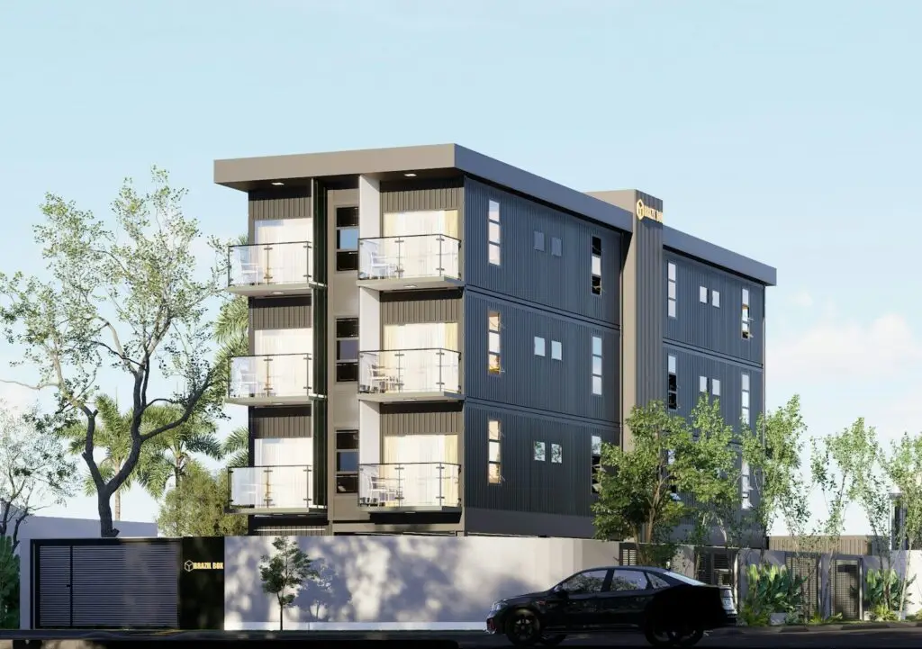 Modern apartment building with balconies and trees